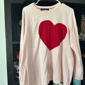 Flattering pastel pink sweater with beautiful red heart